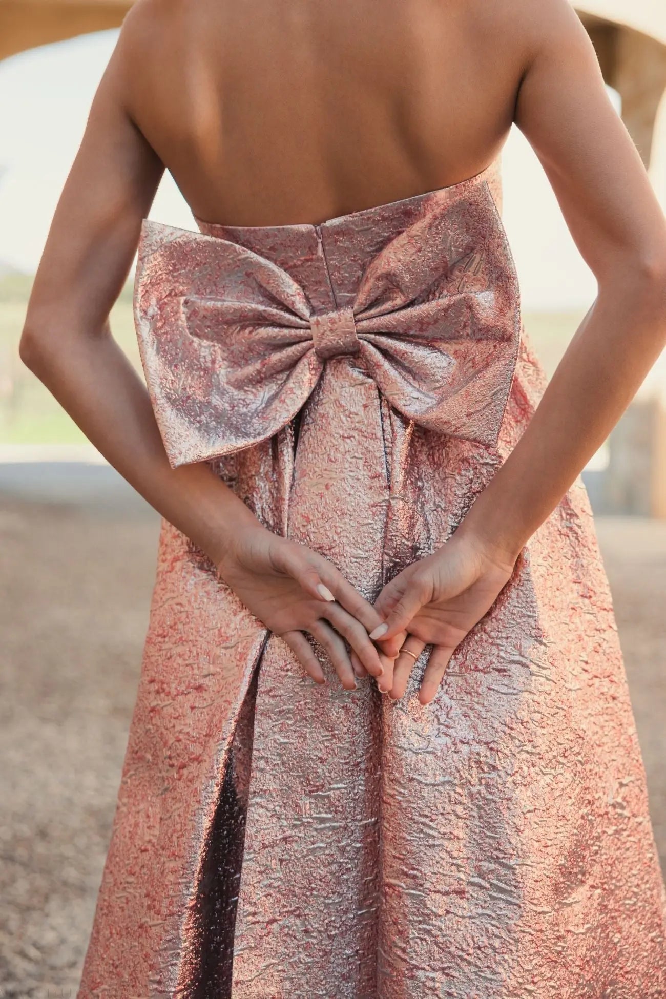 Pink Metallic Strapless Brocade Gown With Oversized Bow